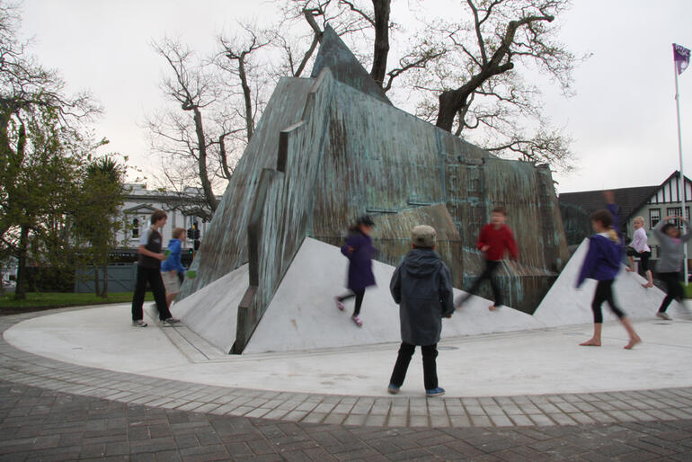 Before the dedication ceremony gets underway, these kids explore the Mountain Fountain's angles.