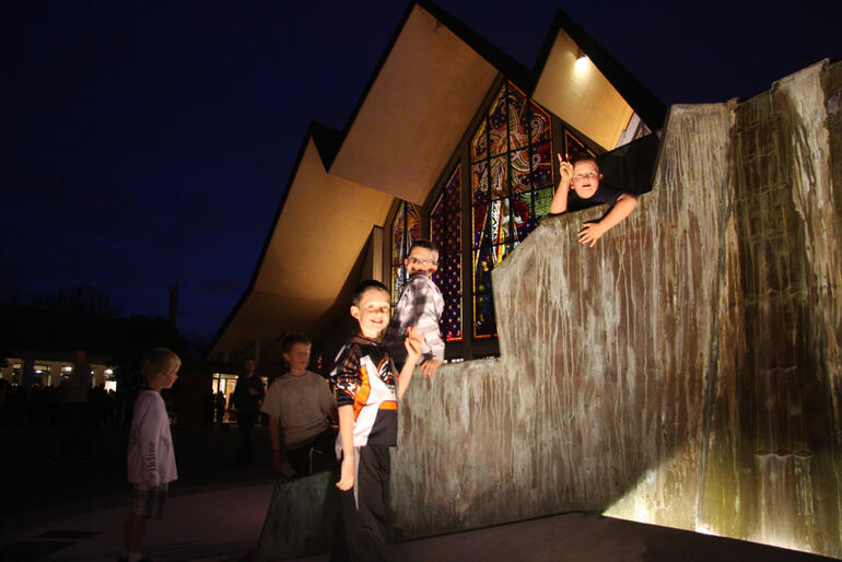 Kids clambering over the new feature in the Holy Trinity Cathedral forecourt.