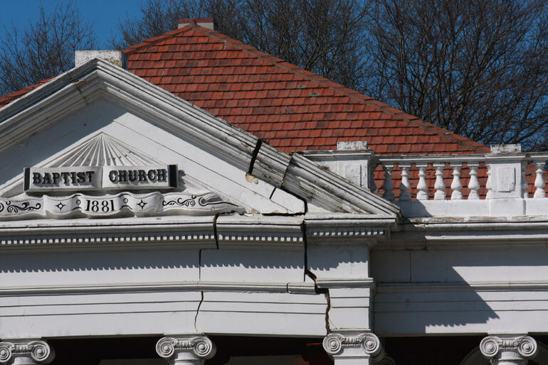 Close up of the damage above the portico of the Oxford St Baptist Church