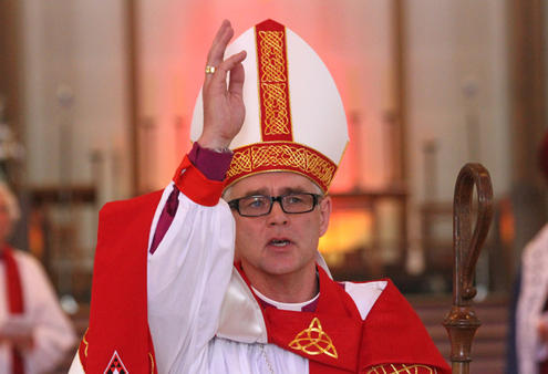 The new Assistant Bishop of the Anglican Diocese of Auckland, Jim White, gives the blessing after his ordination service.