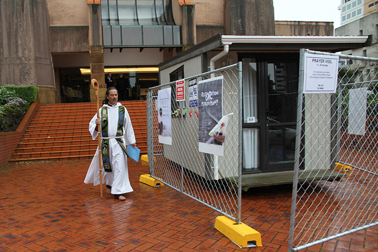 One day down, six more to go. The Eucharist complete, Bishop Justin returns to his cell.