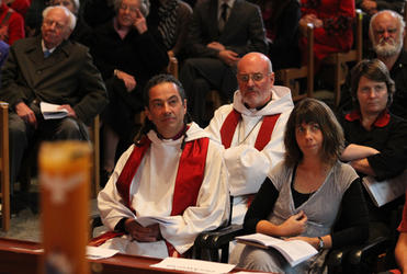 Bishop-elect Justin and his wife Jenny listen as Martin and Alison Robinson preach the sermon.