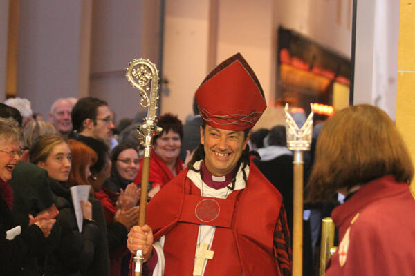 Bishop Justin leaves the cathedral to a standing acclamation.