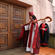 The new bishop strikes The Canterbury Door three times before being led inside to his new cathedra.