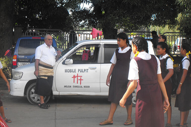 Bishop-elect 'Afa Vaka and his mobile pulpit. Often, he preaches in settings more turbulent than this one.