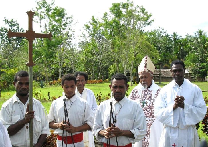 The then Bishop of Popondota prepares to celebrate communion with some members of the Melanesian Brotherhood.