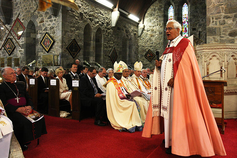 Archdeacon Tiki speaks during the 2010 consecration of St Mary's, New Plymouth, as a full-fledged cathedral. The Archbishop of York listens.
