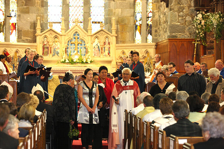 Archdeacon Tiki standing with the people of Parihaka during the 2010 consecration of St Mary's as a cathedral.