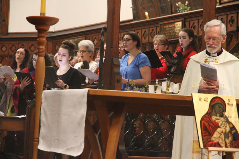 The choir gives it their all during the Hui opening mass.