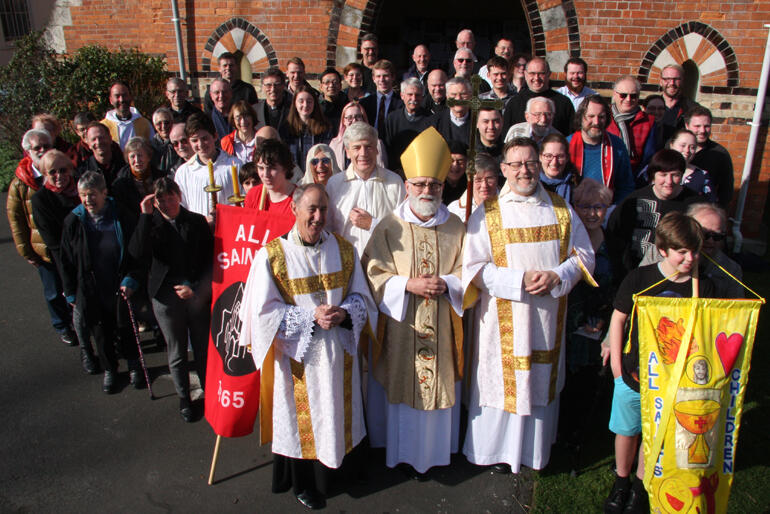 Two bishops down, remaining hui members grab a group shot after the closing mass.