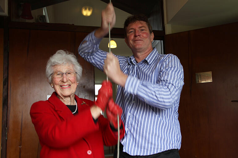 Alice Wylie and her grandson Tim Bennett, road-testing the reconnected bell.