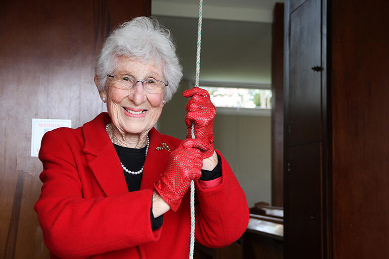Mrs Alice Wylie at the controls of the bell she had given, nearly 60 years earlier.