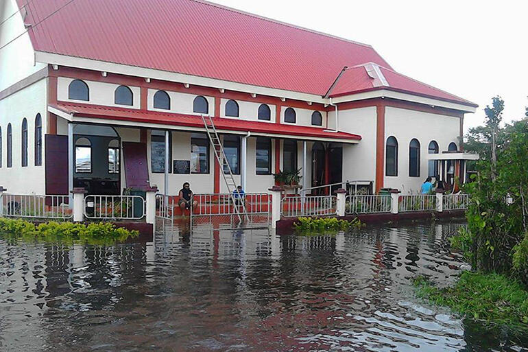 All Saints, Fasi. The floor is millimetres above the flood waters. Pic by Malu Elone.