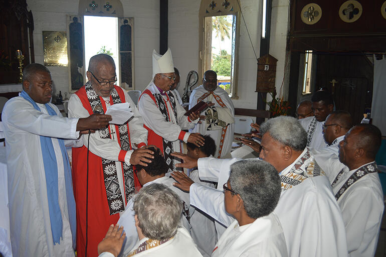 Archbishop Winston and Bishop Api ordain the new priests in Levuka.