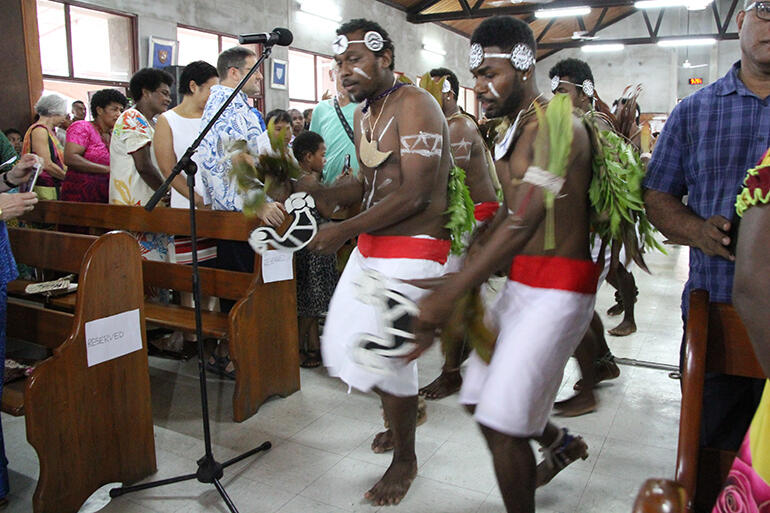 Melanesian clergy and students from PTC in traditional dress staged a dramatic Gospel procession.