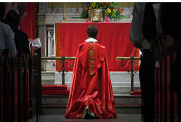 Presiding Bishop Jefferts Schori kneels in repentance over slavery.