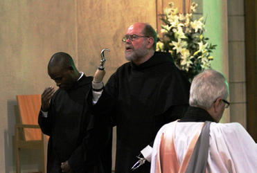 Fr Michael Lapsley pronounces the blessing at Holy Trinity Cathedral's midweek choral Evensong.