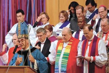 Bishop Bob Duncan with members of his new North American flock. Picture: Church Times.