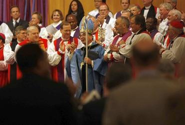 Bishop Robert Duncan is appaluded at United States Evangelical Free Church in Wheaton, Illinois. Picture, LA Times.