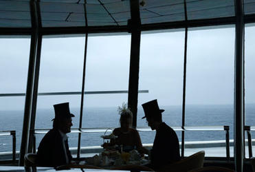Passengers enjoy traditional afternoon tea during the Titanic Memorial Cruise in the mid-Atlantic. Photo: Chris Helgren