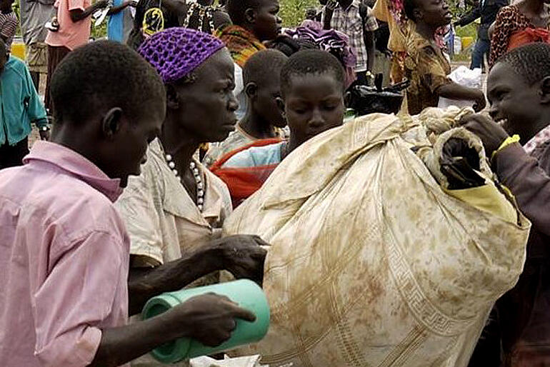 Newly arrived South Sudanese refugees check in at the Elegu Crossing.  Photo: ACT Alliance/P Akullo.