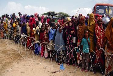 Refugees queue for aid in Somalia. 