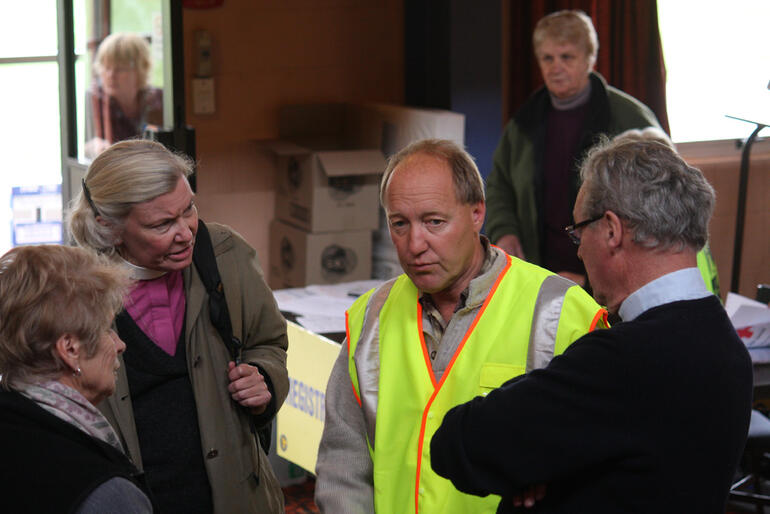 Bishop Victoria and Kaiapoi clergy Geoff Howarth and Jane Davison are updated on civil defence.