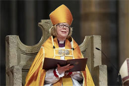 ABC +Sarah sits on the throne of Saint Augustine in golden cope and mitre