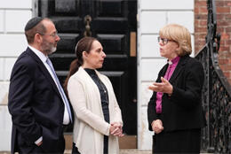 +Sarah Mullally speaks with two UK Jewish leaders in front of their community centre 