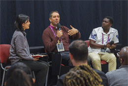 Anglican Archbishop in Jerusalem Hosam Naoum speaks on a conference panel flanked by Agnes Chiu Ki Lam from Hong Kong and Reginald Nikoi Robertson from Ghana 
