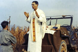 RC military chaplain celebrates mass in front of a jeep in Korea 