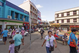 A street scene in Suva show women, men and children