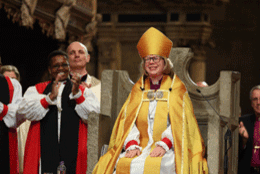 Archbishop Sarah Mullally smiles from the throne of Augustine 
