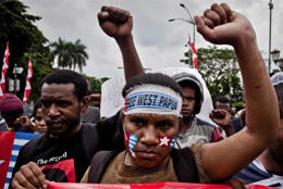 Papuan students raise fists in protest march