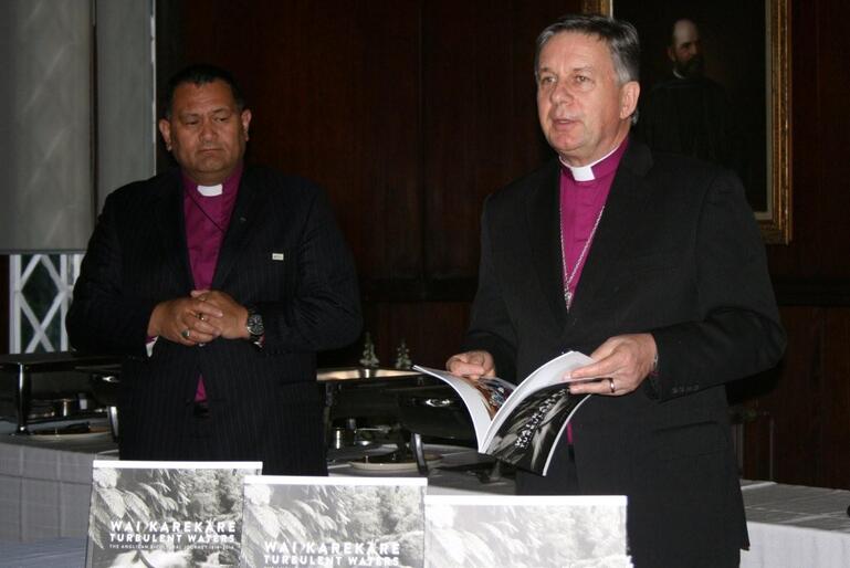 Archbishop David Moxon commends the new book to his audience - while Bishop Kito Pikaahu looks on.