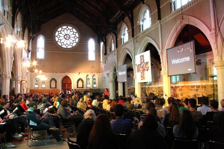 Young folk file into the 6.30pm Sunday service at St Paul's Symonds St.