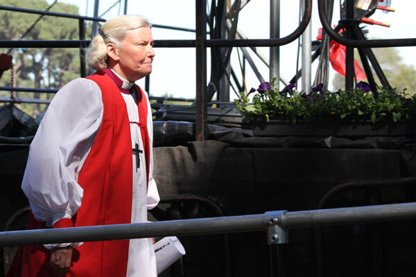 With the service about to begin, Bishop Victoria Matthews ascends the ramp at the back of the main stage.