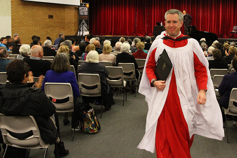 Tim Noon, the Director of Music at Auckland's Holy Trinity Cathedral, vacates the conference to applause.