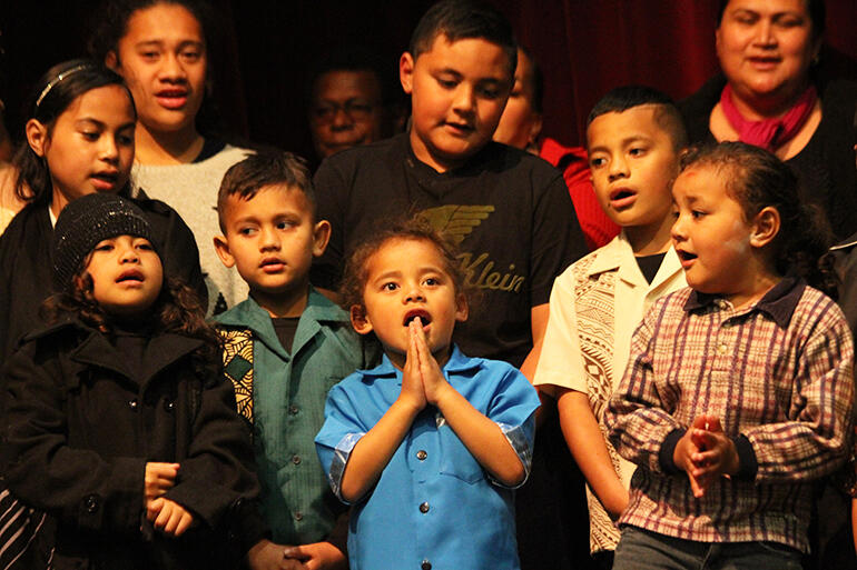 Young Tongan followers of Jesus on stage.