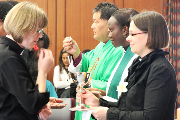 The Rev Dr Helen-Ann Hartley (right) serving the chalice - alongside The Rev Irene Ayallo, and Bishop Kito Pikaahu.