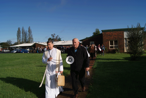 Archbishop David Moxon leads a circular tour of Te Ara Hou social services village in Hillcrest as part of the synod service.