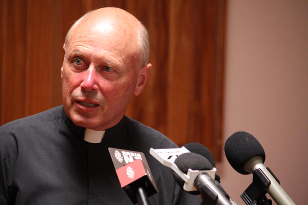 Archdeacon Robin Kingston, who is organising Thursday's remembrance service, conducts a press conference.