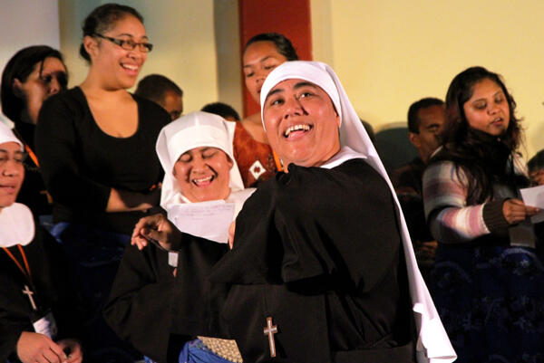 Sr Kalolaine Tuineau dances the Lord's Prayer - with plenty of encouragement from her sisters and brothers in Tikanga Pasefika.