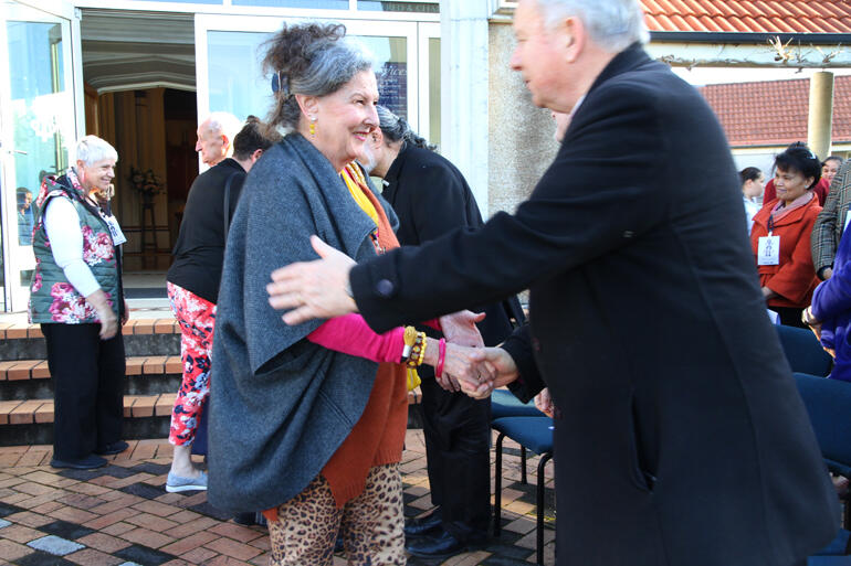 Anthea Mullis from the manuhiri greets Archbishop David Moxon on the tangata whenua side.