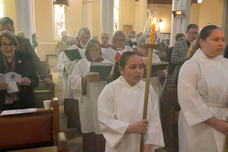 Cathedral servers and choir process into the hui opening mass.