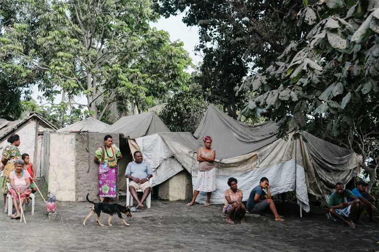 Ambae Islanders with ash-covered tents after the volcanic eruptions. In 2019-2020 Ambae Islanders need help to rebuild and prepare for cyclones.