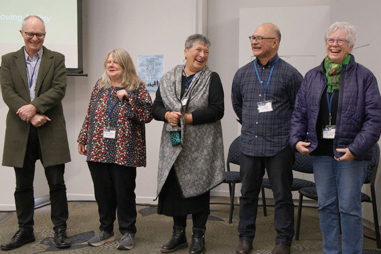 Members of the Anglican Disability Ministry Network staff and oversight group laugh as Rev Leo Te Kira introduces their work.