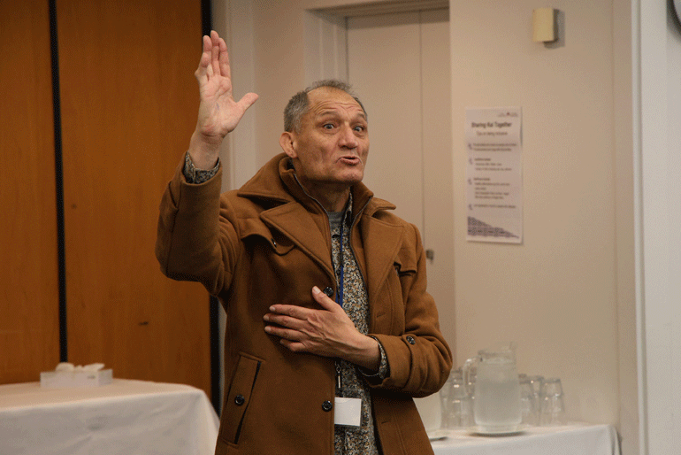 The Reverend Leo Te Kira stands to share his whaikōrero as the Anglican Disability Ministry Summit opens.