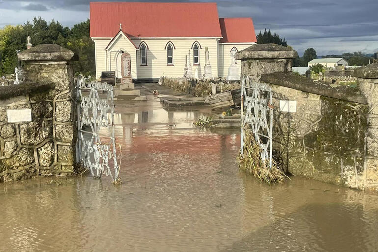 St John's Church in Omahu and its urupa emerge after Cyclone Gabrielle's floodwaters drain.