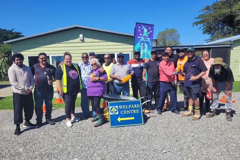Volunteers line up outside Te Whare Hauora o Te Aitanga a Hauiti's post-Cyclone welfare centre in Tolaga Bay.